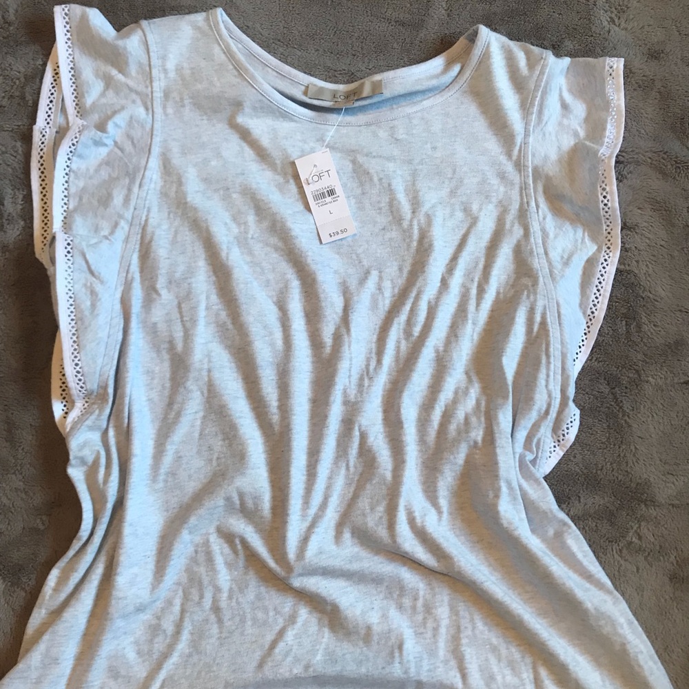 Light blue ruffle shoulder shirt.  NWT.